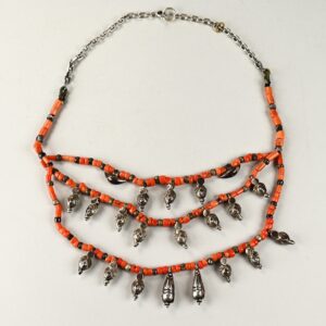 Ethnic multi-strand necklace from Ladakh, made with antique silver elements and three strands of coral beads, 44 cm long with silver pendants 2–2.5 cm high.