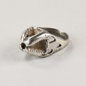 Old ethnic silver ring originating from the Kanuri population of Nigeria.<br>the upper part of the ring is formed by a protrusion measuring 12 millimeters (0.47 inches) in height; this particular shape recalls some architectural models typical of the Kanuri people.